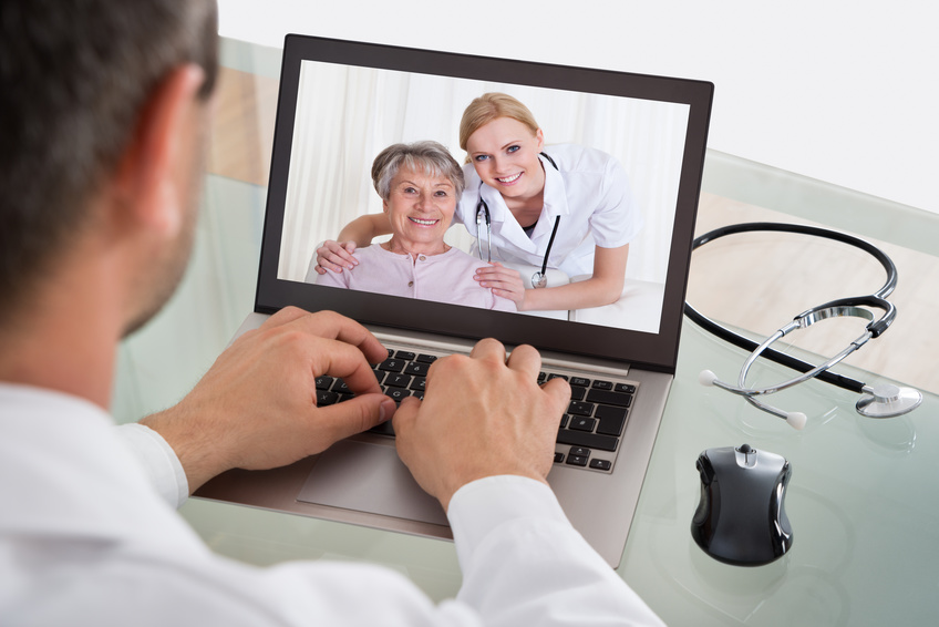 Doctor Having Video Conference With Senior Patient And Nurse